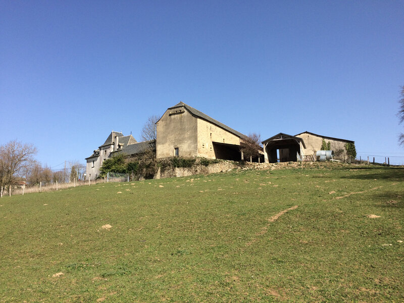 View on the outbuildings from the land